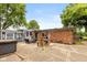Large backyard with a patio, outdoor kitchen, hot tub, and shed, ideal for entertaining at 615 E Stop 11 Rd, Indianapolis, IN 46227
