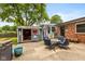 Inviting backyard featuring an outdoor bar, patio set, and well-maintained brick house at 615 E Stop 11 Rd, Indianapolis, IN 46227