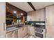 Well-appointed kitchen with stainless steel appliances, modern cabinetry, and sleek countertops at 615 E Stop 11 Rd, Indianapolis, IN 46227