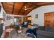 Inviting living room with exposed-beam ceiling, hardwood floors and access to different rooms of the house at 615 E Stop 11 Rd, Indianapolis, IN 46227