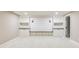 The basement includes a carpeted floor and a built-in bench with shelving and storage spaces at 625 E 57Th St, Indianapolis, IN 46220