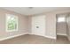 This bedroom has neutral walls, hardwood floors, a window, and a double door closet for ample storage at 625 E 57Th St, Indianapolis, IN 46220