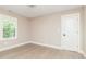 Inviting bedroom with hardwood floors, natural light from a large window, and a neutral color palette at 625 E 57Th St, Indianapolis, IN 46220