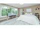 Bright bedroom with large windows, neutral decor, and modern accents at 625 E 57Th St, Indianapolis, IN 46220