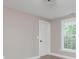 This bedroom features neutral walls, hardwood floors, and a window letting in plenty of natural light at 625 E 57Th St, Indianapolis, IN 46220