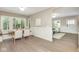 Dining area with built-in bench seating, wainscoting, and views to the entry and living areas at 625 E 57Th St, Indianapolis, IN 46220