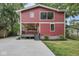 This home has a large front yard, a porch, and red siding at 625 E 57Th St, Indianapolis, IN 46220