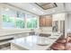 Spacious kitchen with center island, stainless steel appliances, and bright natural lighting at 625 E 57Th St, Indianapolis, IN 46220