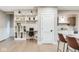 Open-concept kitchen with built-in desk area and shelving at 625 E 57Th St, Indianapolis, IN 46220