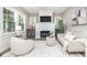Comfortable living room featuring a fireplace, TV, and neutral decor with ample natural light at 625 E 57Th St, Indianapolis, IN 46220
