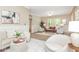 Cozy living area with soft furnishings, an inviting atmosphere, and views into other rooms at 625 E 57Th St, Indianapolis, IN 46220