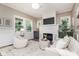 Stylish living room with modern lighting, fireplace, and comfortable seating, creating a relaxing atmosphere at 625 E 57Th St, Indianapolis, IN 46220
