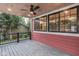 This covered porch features a ceiling fan and plenty of space to relax and enjoy the outdoors at 625 E 57Th St, Indianapolis, IN 46220