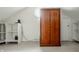 Attic space with storage solutions, including shelving and a wardrobe at 6307 Keeneland Ct, Indianapolis, IN 46278