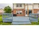 Wooden deck with grey finish overlooking vast grassy backyard, perfect for outdoor living at 6307 Keeneland Ct, Indianapolis, IN 46278