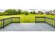 View from the back deck to the property's wide and grassy green lawn at 6307 Keeneland Ct, Indianapolis, IN 46278