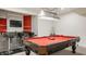 Recreational basement area showcasing a pool table and a bar with seating at 6307 Keeneland Ct, Indianapolis, IN 46278