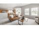 Cozy open-concept living room with leather sofa and a view into the kitchen and dining area at 6307 Keeneland Ct, Indianapolis, IN 46278