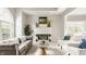 Living room with a fireplace and mantle, decorative accents, and comfortable seating area at 6307 Keeneland Ct, Indianapolis, IN 46278