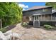 Inviting backyard patio and a deck with stairs, surrounded by mature trees and lush landscaping at 6350 Red Oak Dr, Avon, IN 46123