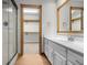 Bright bathroom with a glass-enclosed shower, white vanity, and an open closet area at 6350 Red Oak Dr, Avon, IN 46123