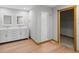 Well-lit bathroom with walk-in shower, dual vanity, and tile floors at 6350 Red Oak Dr, Avon, IN 46123