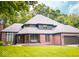 Beautiful brick home with attached garage, mature trees, and well-manicured lawn at 6350 Red Oak Dr, Avon, IN 46123