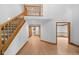 Open concept entry with wooden staircase and hardwood floors at 6350 Red Oak Dr, Avon, IN 46123