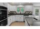 Kitchen features granite countertops, stainless steel appliances, and white cabinetry at 6350 Red Oak Dr, Avon, IN 46123