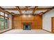 Elegant living room with wood paneling, coffered ceiling, and fireplace at 6350 Red Oak Dr, Avon, IN 46123