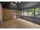 Screened in porch with brick and wood paneling and natural light at 6350 Red Oak Dr, Avon, IN 46123
