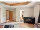 Primary bedroom featuring textured ceilings, access to a bathroom, and a TV at 6396 Granny Smith Ln, Avon, IN 46123
