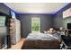 Comfortable bedroom with window, bed, and storage with black accent wall at 6396 Granny Smith Ln, Avon, IN 46123