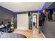 Cozy bedroom featuring desk, closet, TV, and doorway to another room at 6396 Granny Smith Ln, Avon, IN 46123