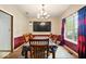 Formal dining room features chandelier, table, and view of outdoor window at 6396 Granny Smith Ln, Avon, IN 46123