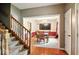 View of formal dining room from staircase and hardwood flooring at 6396 Granny Smith Ln, Avon, IN 46123