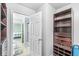 This bathroom is attached to a walk-in closet and a view of the bedroom at 671 Sonoma Ln, Greenfield, IN 46140