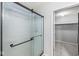 A bathroom features a glass shower and attached walk-in closet at 671 Sonoma Ln, Greenfield, IN 46140