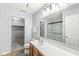 This bathroom features a large vanity, frosted shower and attached walk-in closet at 671 Sonoma Ln, Greenfield, IN 46140
