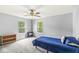Bedroom with a ceiling fan and two large windows providing ample natural light at 671 Sonoma Ln, Greenfield, IN 46140