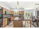 Modern kitchen featuring stainless appliances, granite countertops, and a view to the back yard at 671 Sonoma Ln, Greenfield, IN 46140