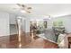 Spacious living room with hardwood floors, an open layout, and access to stairs and other rooms at 671 Sonoma Ln, Greenfield, IN 46140