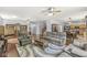 Expansive living area showcasing hardwood floors, cozy seating, and an open layout leading to the kitchen at 671 Sonoma Ln, Greenfield, IN 46140