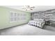 The main bedroom has large windows, an accent wall and ceiling fan at 671 Sonoma Ln, Greenfield, IN 46140