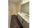 Modern bathroom with double sink vanity and combination tub/shower at 6744 Redan Dr, Indianapolis, IN 46254