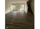 Spacious living room featuring a sliding glass door that leads to a patio area at 6744 Redan Dr, Indianapolis, IN 46254