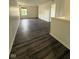 Open living area with nice flooring, natural light, and neutral walls at 6744 Redan Dr, Indianapolis, IN 46254