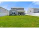 Well maintained backyard, green grass and white fence at 6830 Park Grove Blvd, Whitestown, IN 46075