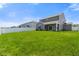 View of a backyard, with green grass and white picket fence at 6830 Park Grove Blvd, Whitestown, IN 46075