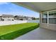 A covered patio extends to a well-manicured backyard and lawn at 6830 Park Grove Blvd, Whitestown, IN 46075